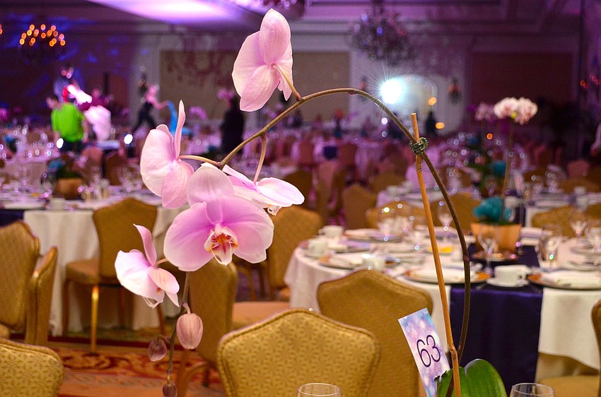 The beautiful orchid centerpieces at SPARCCLE on the Runway