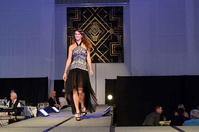 Rachel Rossi models a 1920s inspired gown designed by Alice Bee.