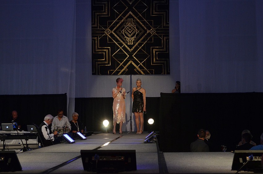 Chairwoman Marilee Roberts introduces designer Alice Bee before the runway show.