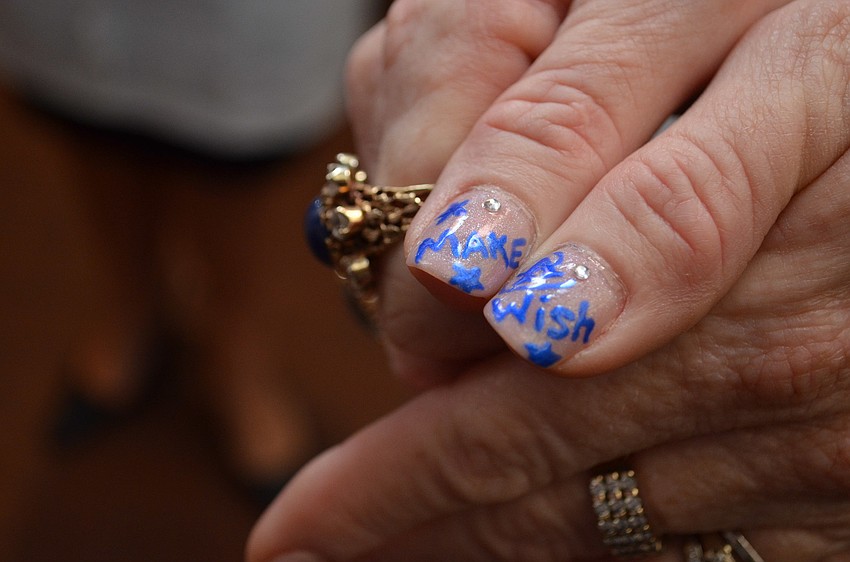 Co-Chair Terri Klauber sported â€œMake-A-Wishâ€ nails at Cooking for Wishes.