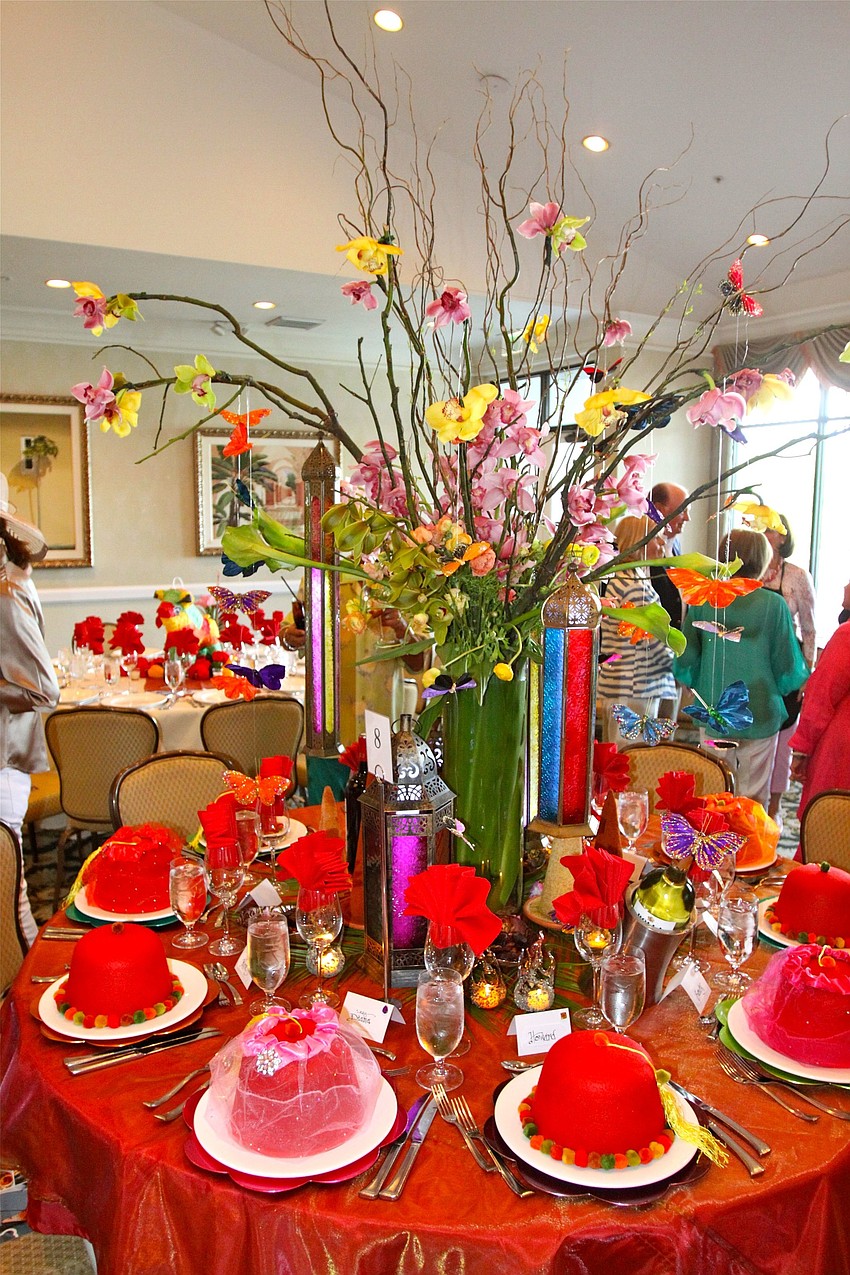 Ron Giarrussoâ€™s table was Moroccan themed and had a gorgeous display of orchids, lanterns and Moroccan hats for each of his guests.