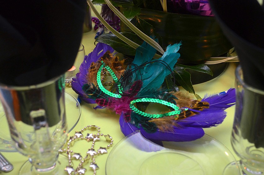 Mardi Gras masks were at each table at â€˜Countdown to Mardi Gras.â€™