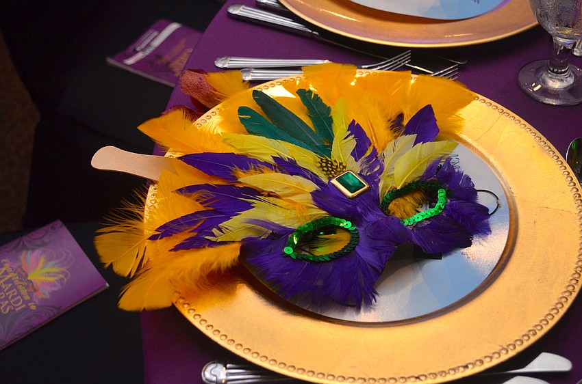 Mardi Gras masks were at each table at â€˜Countdown to Mardi Gras.â€™