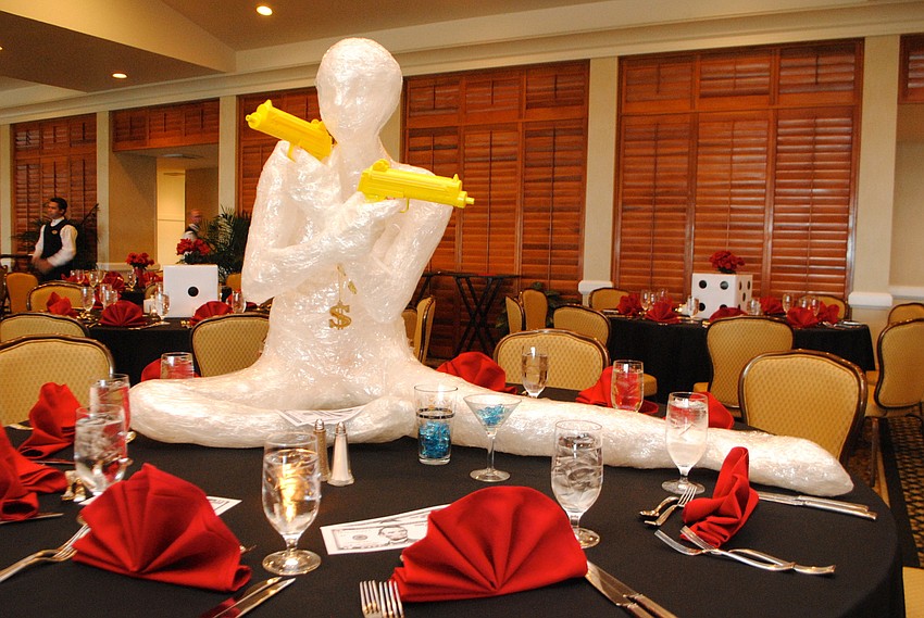 The Longboat Key Club Harbourside Dining Room was decorated with a casino theme for â€˜An Evening at Casino Royale.â€™