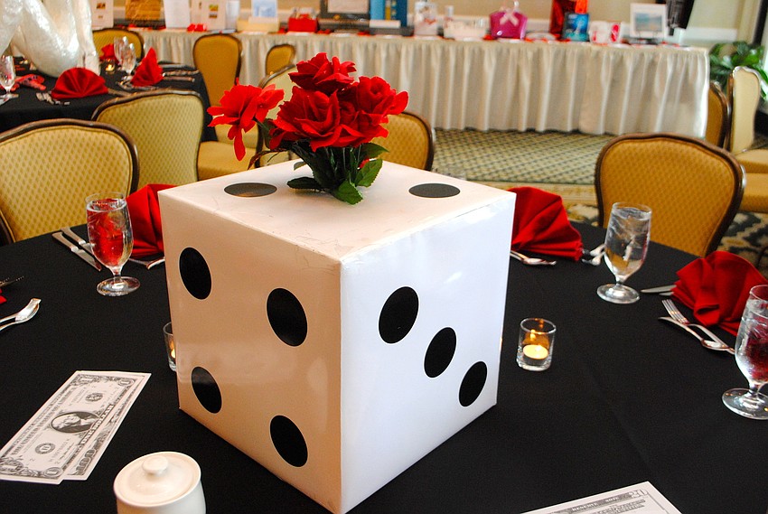 The Longboat Key Club Harbourside Dining Room was decorated with a casino theme for â€˜An Evening at Casino Royale.â€™