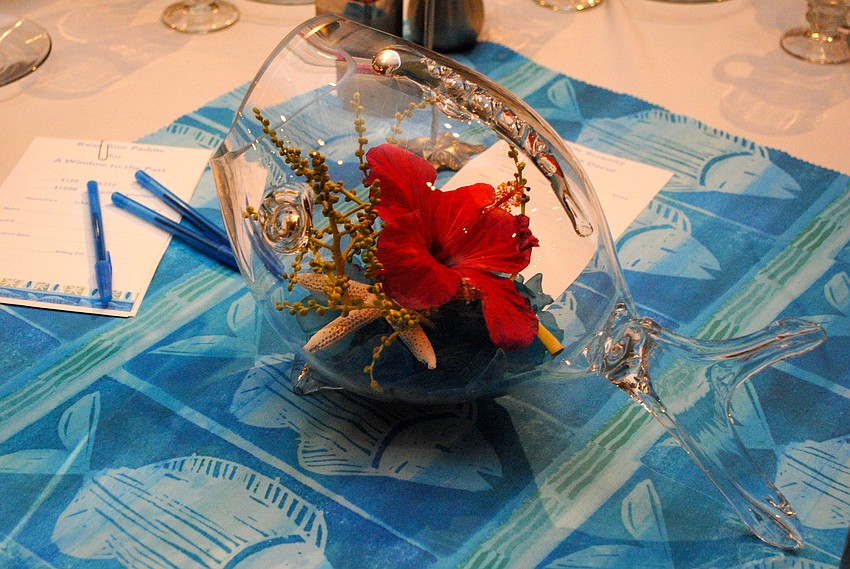 Fish bowls filled with flowers and starfish were used at centerpieces for the Seaside Serenity luncheon.
