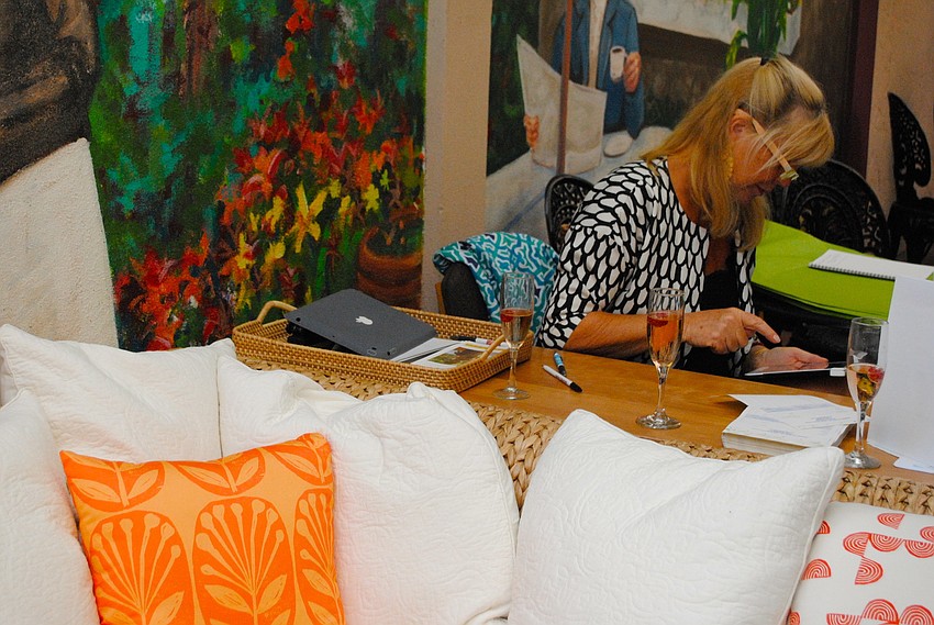 Designer Sigrid Olsen personally wraps items bought during the pop-up shop at Seaside Serenity.