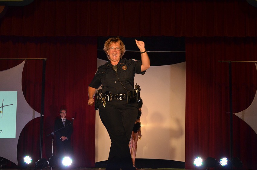 Officer Carmen Woods of the Sarasota Police Department runs and dance on stage during the final performance.