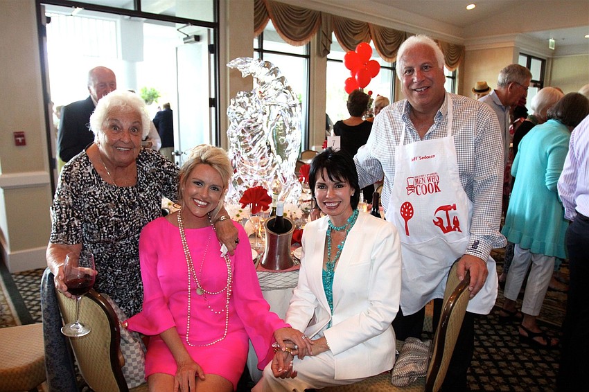 Marge Sedacca, Montana Taplinger and Nikki and Jeff Sedacca had an ice sculpture of a shrimp as their centerpiece.