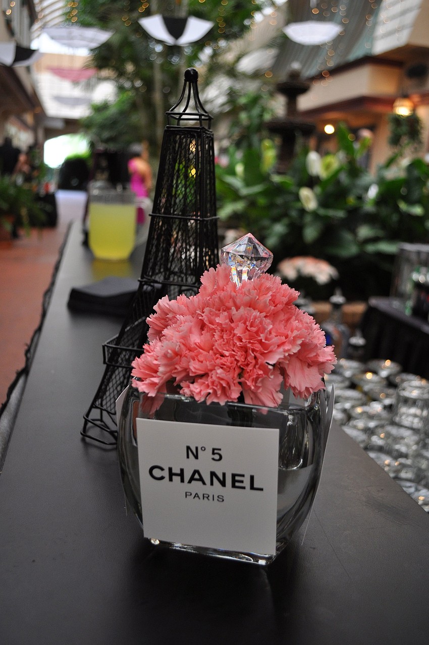 Statues of the Eiffel Tower and bottles with pink flowers and Chanel No. 5 labels were part of the dÃ©cor.