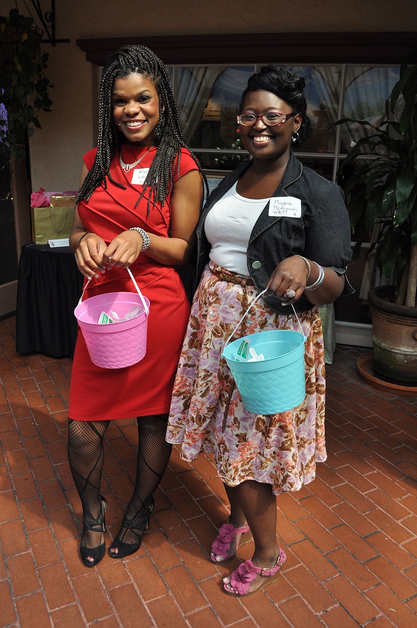 Alyssa White and Mydra McKinnon selling raffle tickets