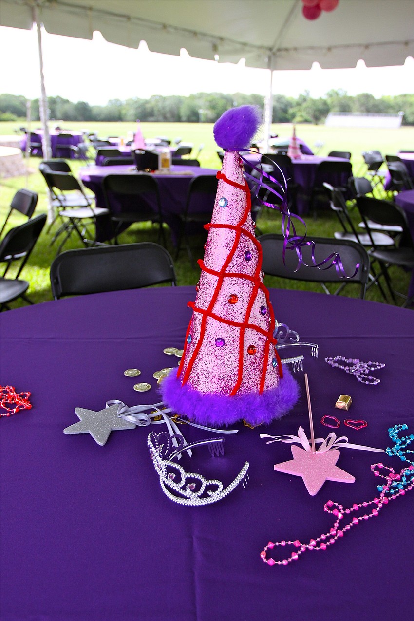 A table full of princess themed decorations.