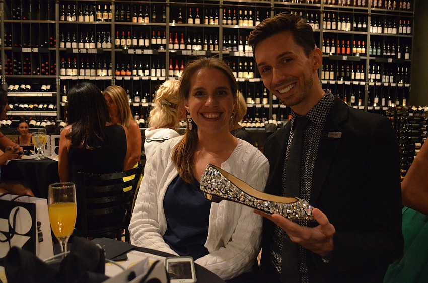 Tyler West shows Renee Wyatt a fabulous pair of Jimmy Choo flats.