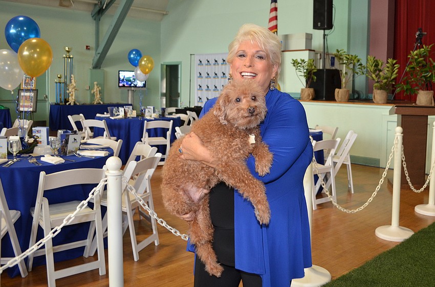 Marsha Panuce with Sampson, a Rastafarian poodle.