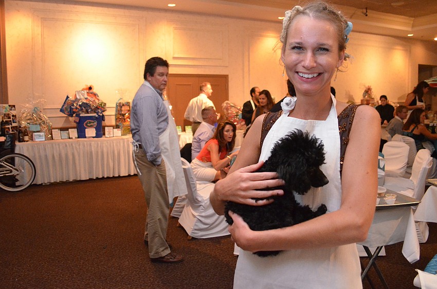 Amy Pluto with Saint the poodle.