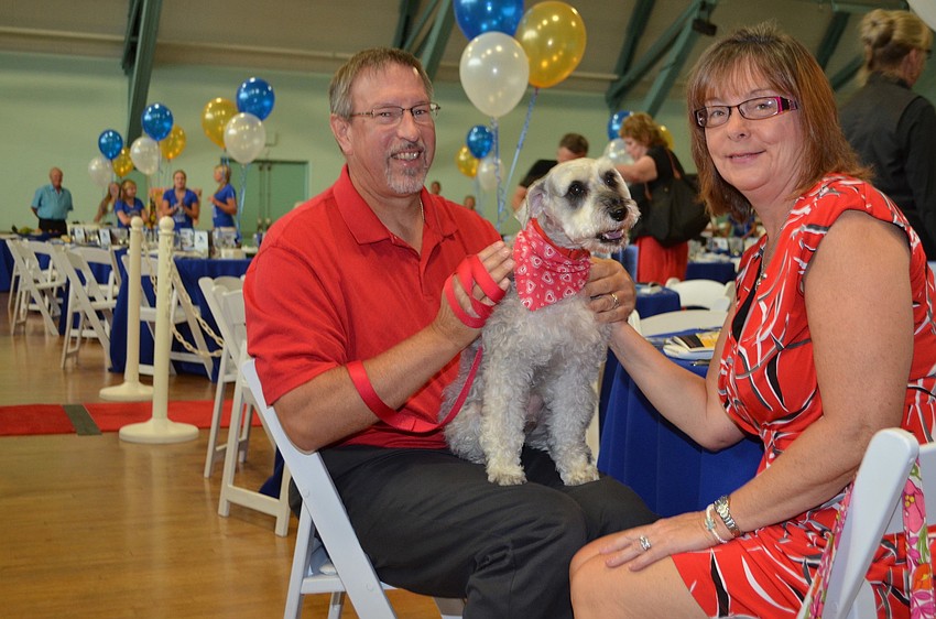 Steve and Linda Rennhack with Comet, the miniature schnauzer.