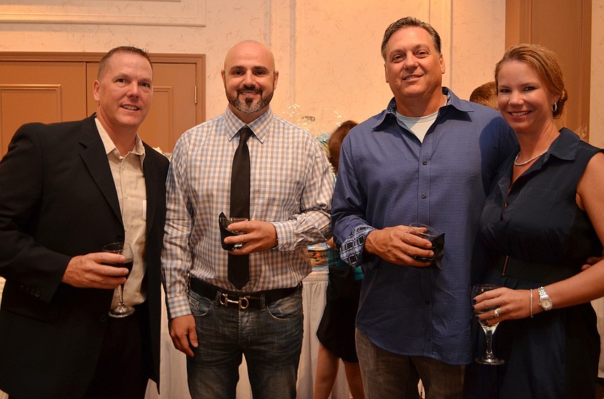 Vern Smith and Dr. Ken Liszewski with Maurice and Tammy Dentici