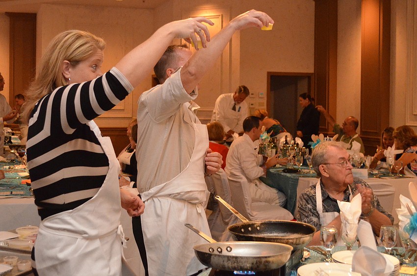 Andrea and Vern Smith hold up their oil and get ready to start cooking.