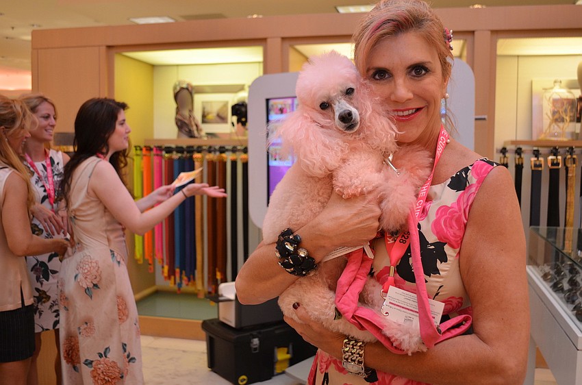 Lori Lawson with her pink poodle Gigi.