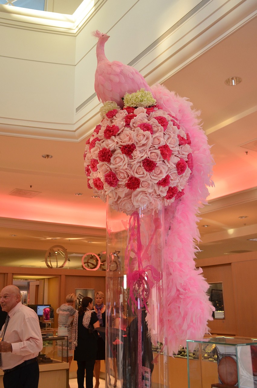 Gorgeous pink peacocks decorated the counters of Saks Fifth Avenue Thursday, Oct. 17, for Key to the Cure.