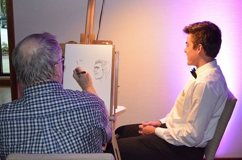 Connor Jones gets a caricature of himself done.