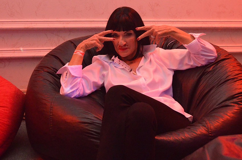 President/CEO of Planned Parenthood of Southwest and Central Florida Barbara Zdravecky lounges at the Safe Sex Halloween Bash as Mia from Pulp Fiction.