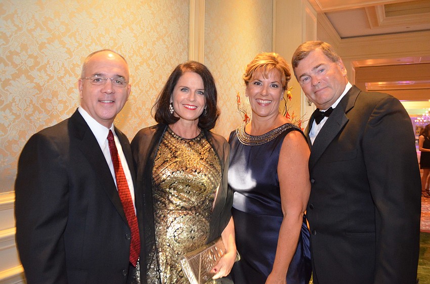 Larry and Sheri Ellis with Cari Fallen and Howard Akey