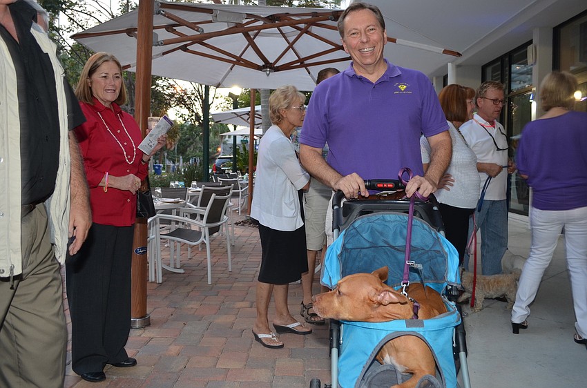 Tom Hudson with Pippi the three-legged pit bull.