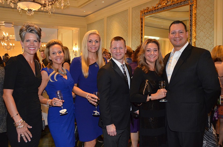 Sally Schule, Nicole Behar, Melissa Howard and Joel Ellzey with Jessica and Octavio Ortiz