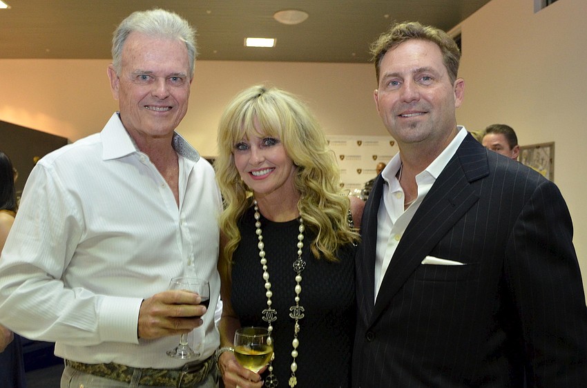 Dan and Donna Brierton with Lamborghini Sarasota general manager Darrin Chrisman