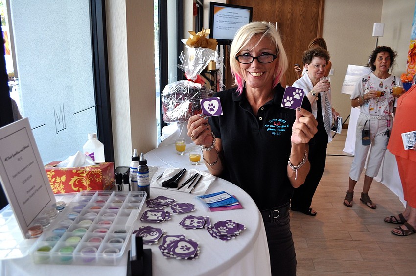 LJ Hanna had a temporary tattoo station set up for the Paws on the Catwalk event at The Francis.