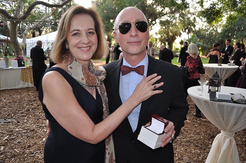Ann Logan poses with Yanni Kyriazis while wearing the Mimosa Bark ring with natural color amethyst.