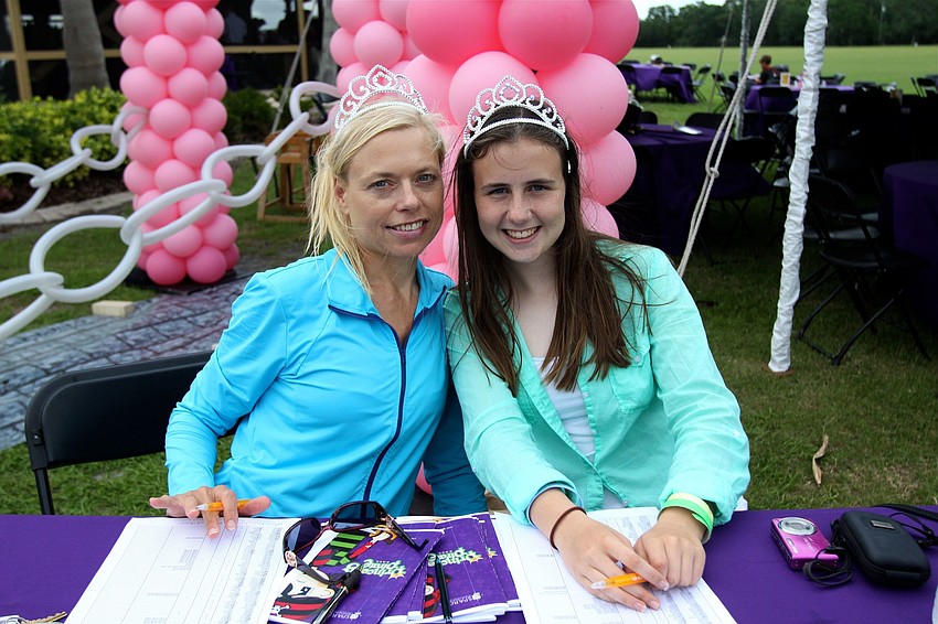 Mandy Riebe and Lizzy Riebe helped to check people in at the event.
