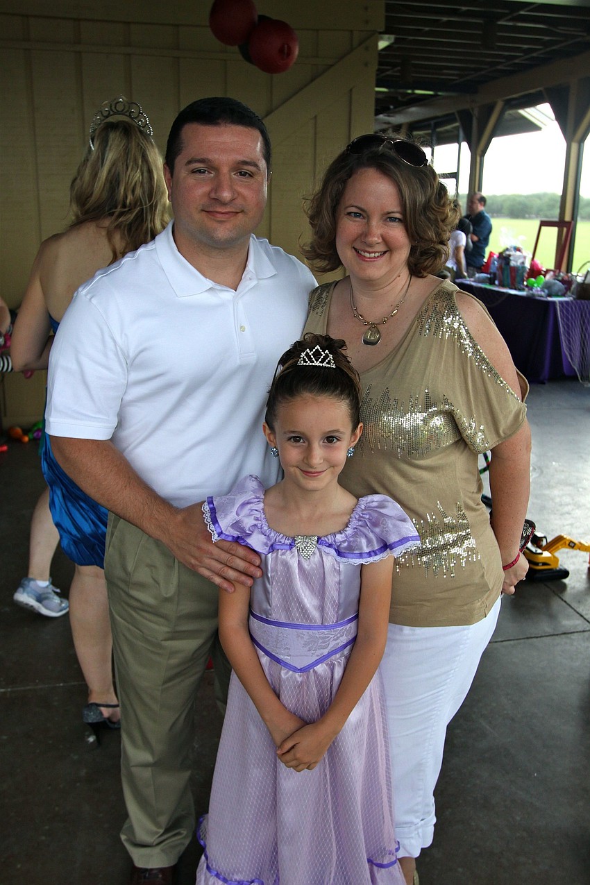 Tom and Jessica Balos with their daughter Eva, 7.