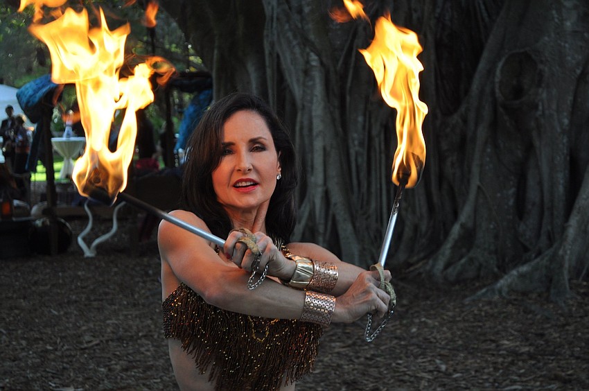 One of the dancers with International Productions by Tahja dances with fire.