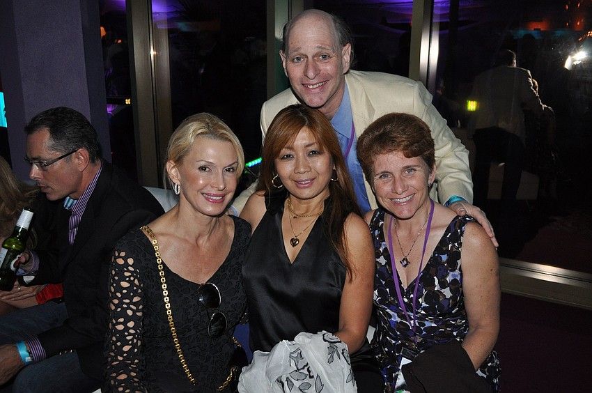 Chuck Sidlow poses behind Elizabeth Flower, Noriko Sidlow and Nancy Berman