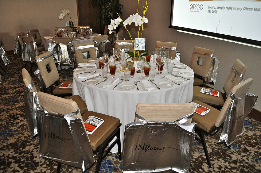 The tables had orchids as the centerpieces and each person got a large gift bag from Influence.
