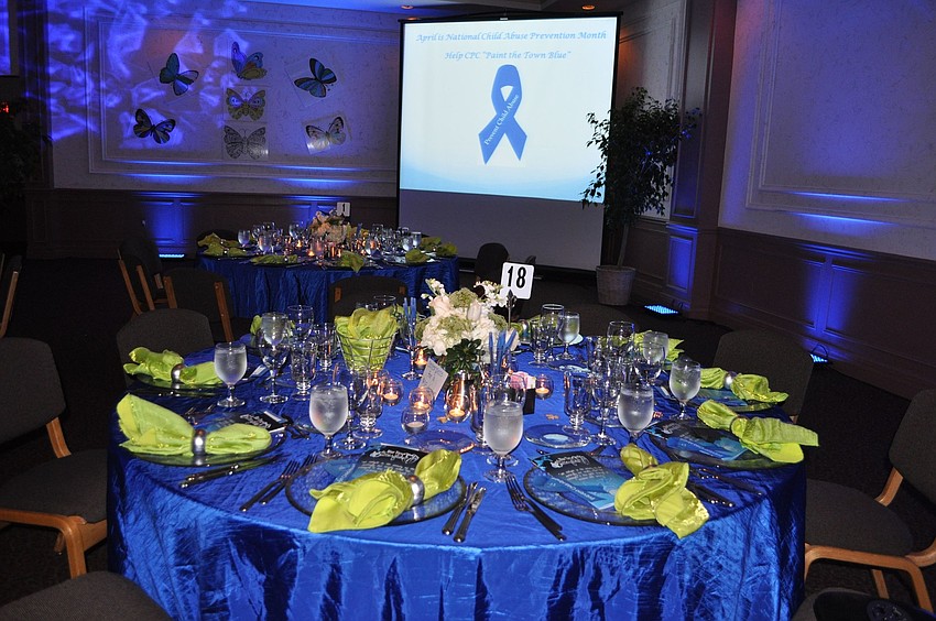 The tables were decorated with sapphire tablecloths, lime napkins and white flowers as the centerpieces.