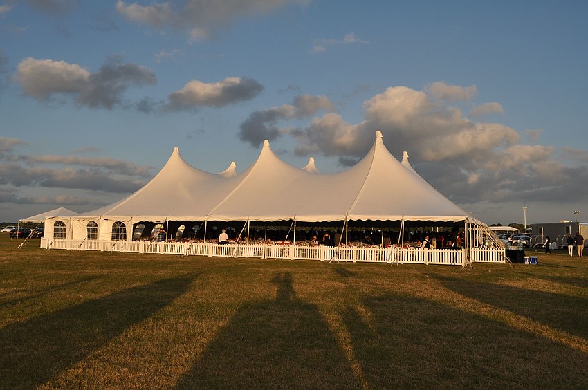 Hundreds of people enjoyed sipping wine, listening to live music and dining underneath the large tent out on one of the fields at Premier Sports Campus.