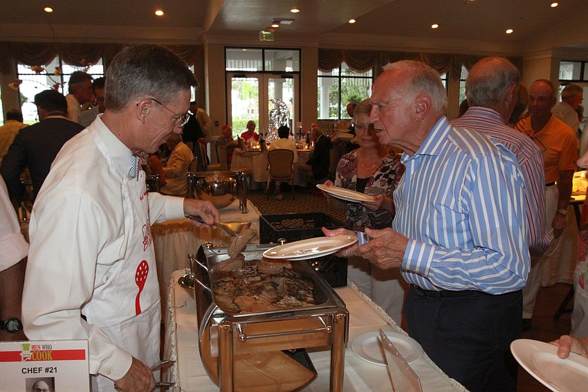 Matt Walsh serves up his dish at the Third Annual Men Who Cook.
