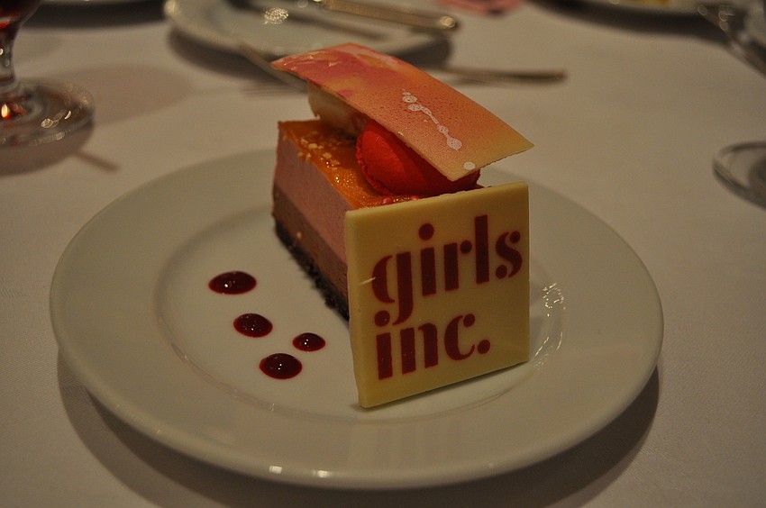 The dessert featured a piece of white chocolate with the Girls Inc. logo.