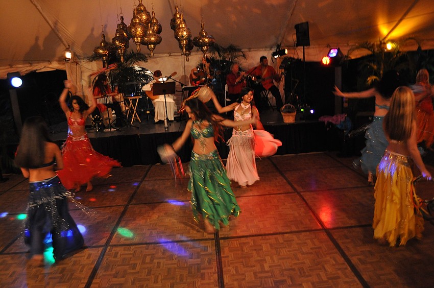 Dancers from International Productions by Tahja perform on the dance floor underneath the tent.