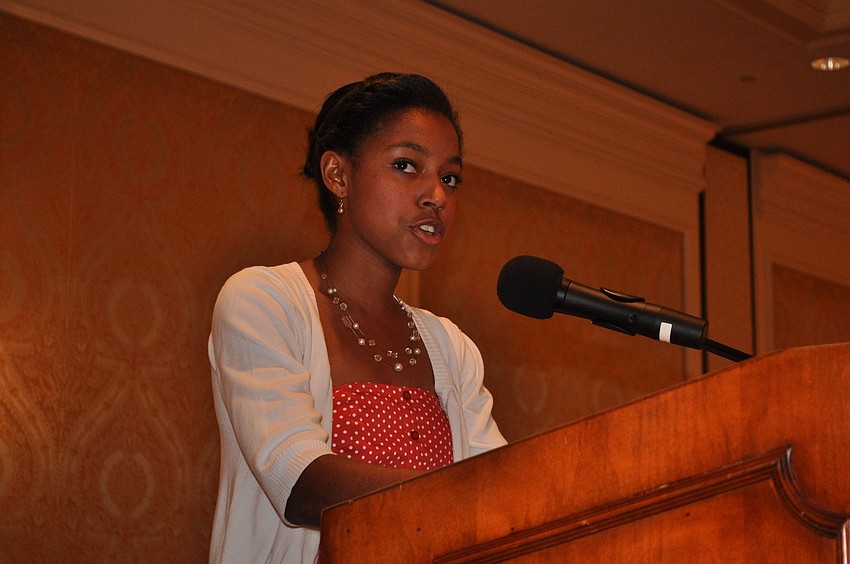 Gabrielle Holt talks to the crowd about her time at Girls Inc.