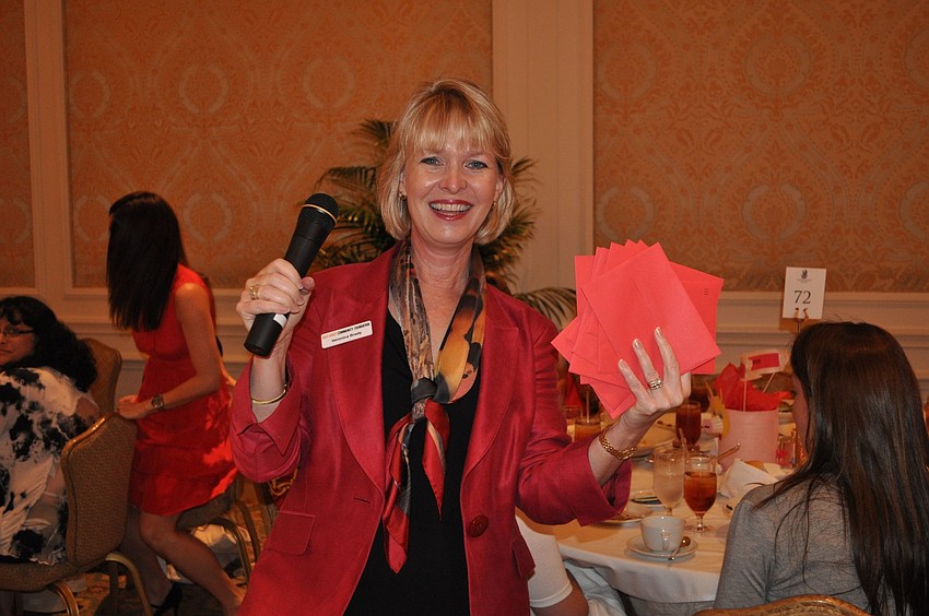 Veronica Brady shows off all the red envelopes she collected.