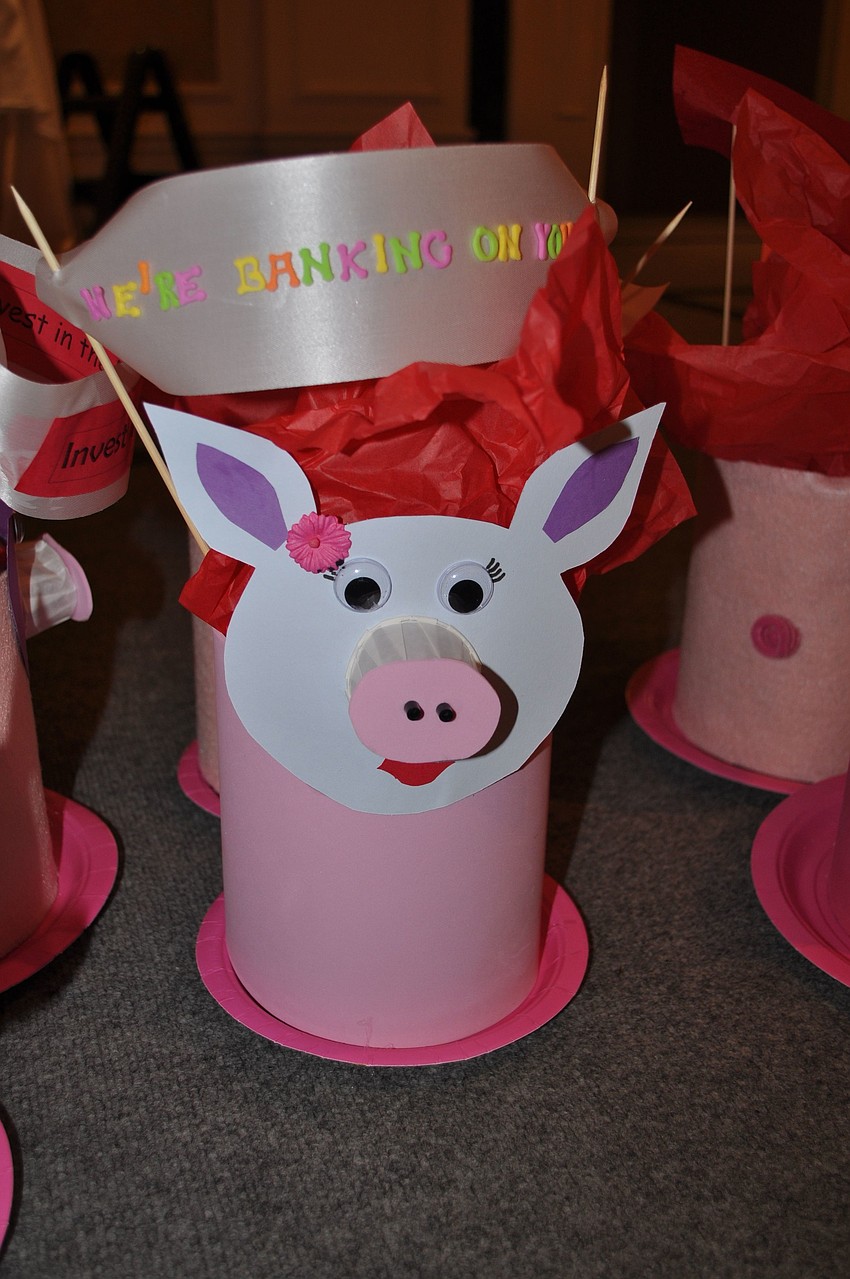 Big pig looking piggy banks were the centerpieces at each of the tables at the luncheon.