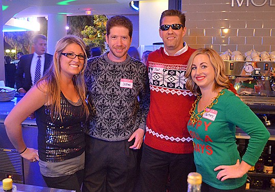 Chelsea Fray, Dr. Joshua Kreithen, Paul Anderson and Courtney Franklin hold down the bar