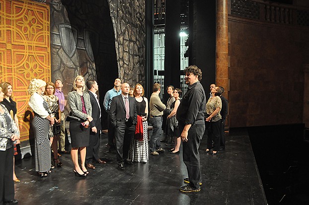 Guests take a backstage tour of the opera house