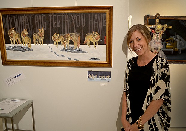Leslie Gnaegy stands in front of her piece