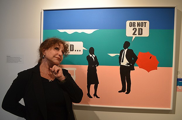 Marcia Ente stands with her piece