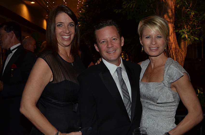 Liz McNelis with Chris and Shannon Pokorski